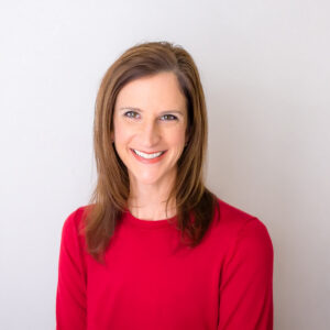 Headshot of Terri in red sweater